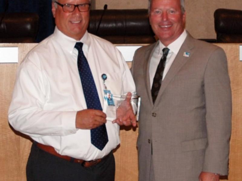 10th Annual Exhibit Coordinator Paul Wenzel accepting the NAP 10th Anniversary Award presented by Mayor Buddy Dyer