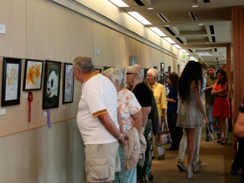 7th Annual Exhibit Attendees taking in the artwork on view at the Aurora Municipal Center