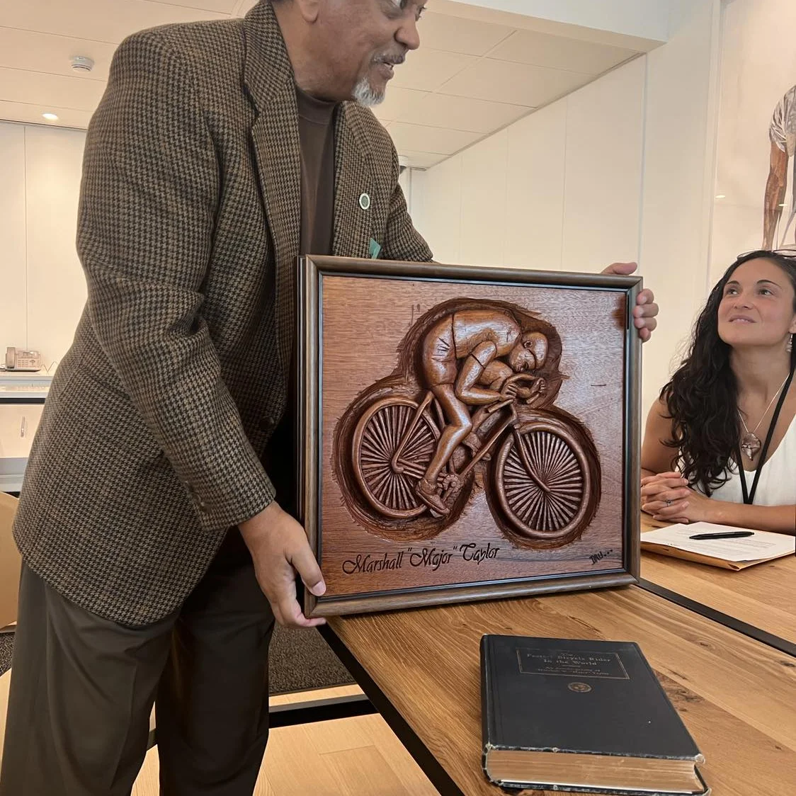 Me presenting/donating my mahogany carving of Marshall Walter (Major)Taylor to the International African American Museum in Charleston South Carolina