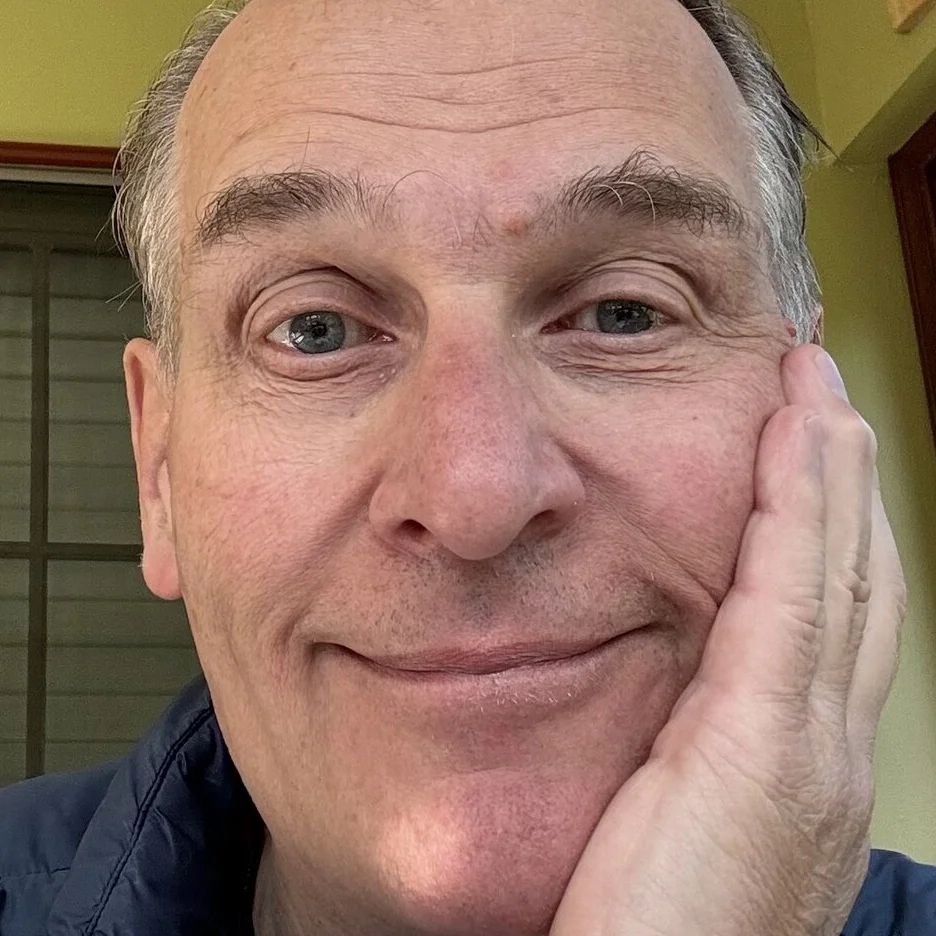 Face resting on left hand