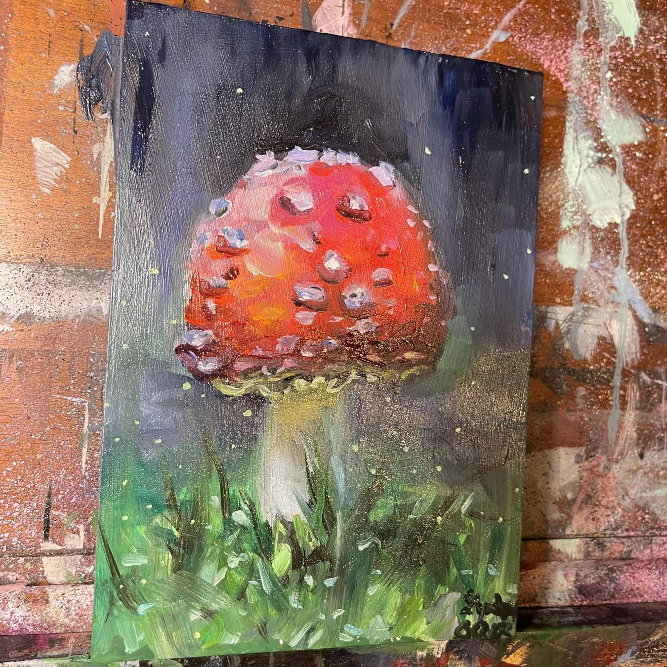 A painting of a fly amanita mushroom.