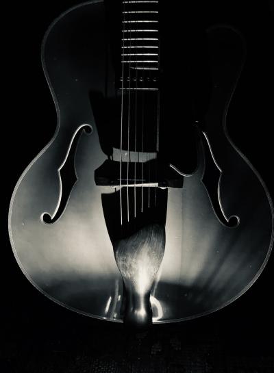 Late night photo of Eastman archtop  jazz guitar, 2022. I used an iPhone SE with illumination.