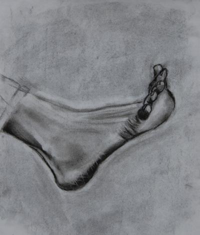 A charcoal drawing of a flexed foot.