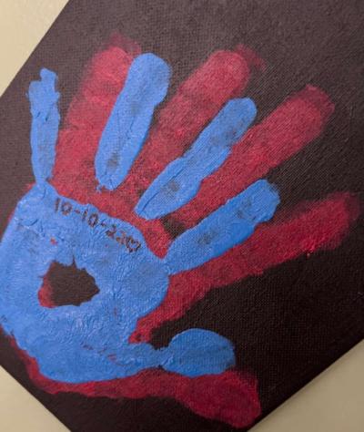 a blue hand surrounded by a red hand