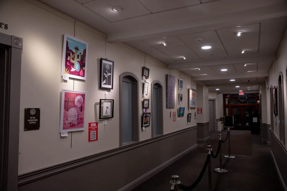 Hallway filled with artworks from the 15th Annual Show