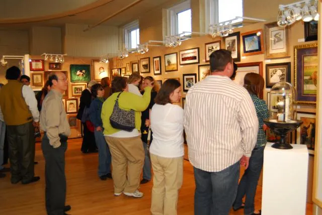 2nd Annual Exhibit People taking in the art at the awards reception.