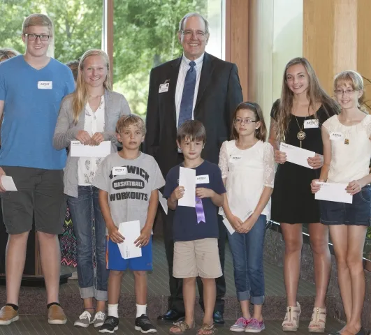 4th Annual Exhibit Regional President & CEO, Dr. Kapaska with Continuing Art Education Scholarship winners at the awards reception.