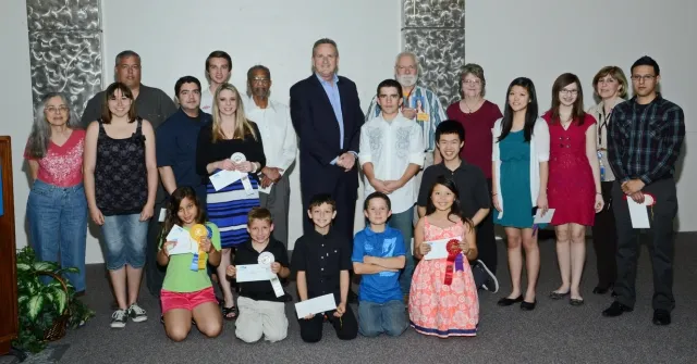 7th Annual Exhibit Award winners posed for a picture with DFW Airport CEO Jeff Fegan at the reception on May 7th.