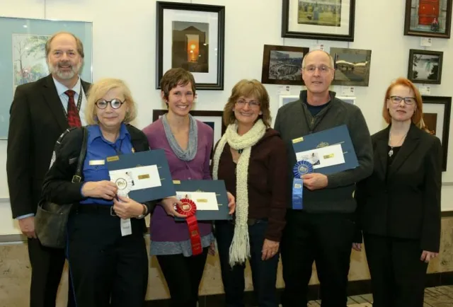 4th Annual Exhibit Adult Professional Winners displaying their awards with Denny Probst, Executive VP of Minneapolis-St. Paul Airport and Sue Gens, Executive Director of the MN State Art Board.