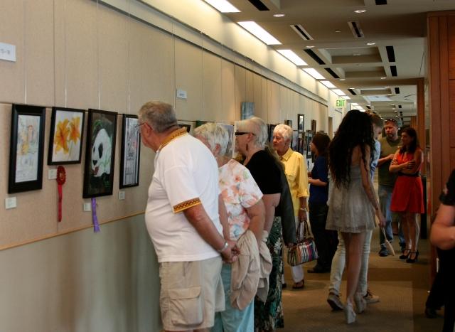 7th Annual Exhibit Attendees taking in the artwork on view at the Aurora Municipal Center