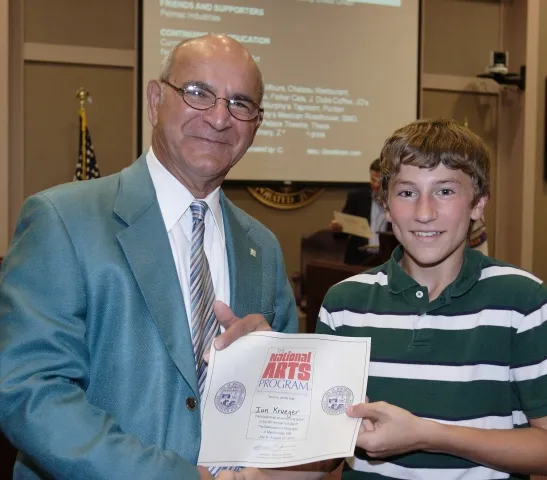 5th Annual Exhibit Ian Krueger accepting his Certificate of Participation