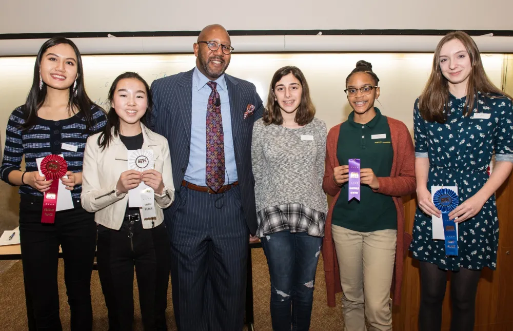 7th Annual Exhibit Teen winners posing with COO Walter Douglas at the awards reception.