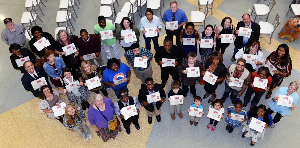 1st Annual Exhibit Award winners proudly displaying their certificates at the reception at the Tubman Museum