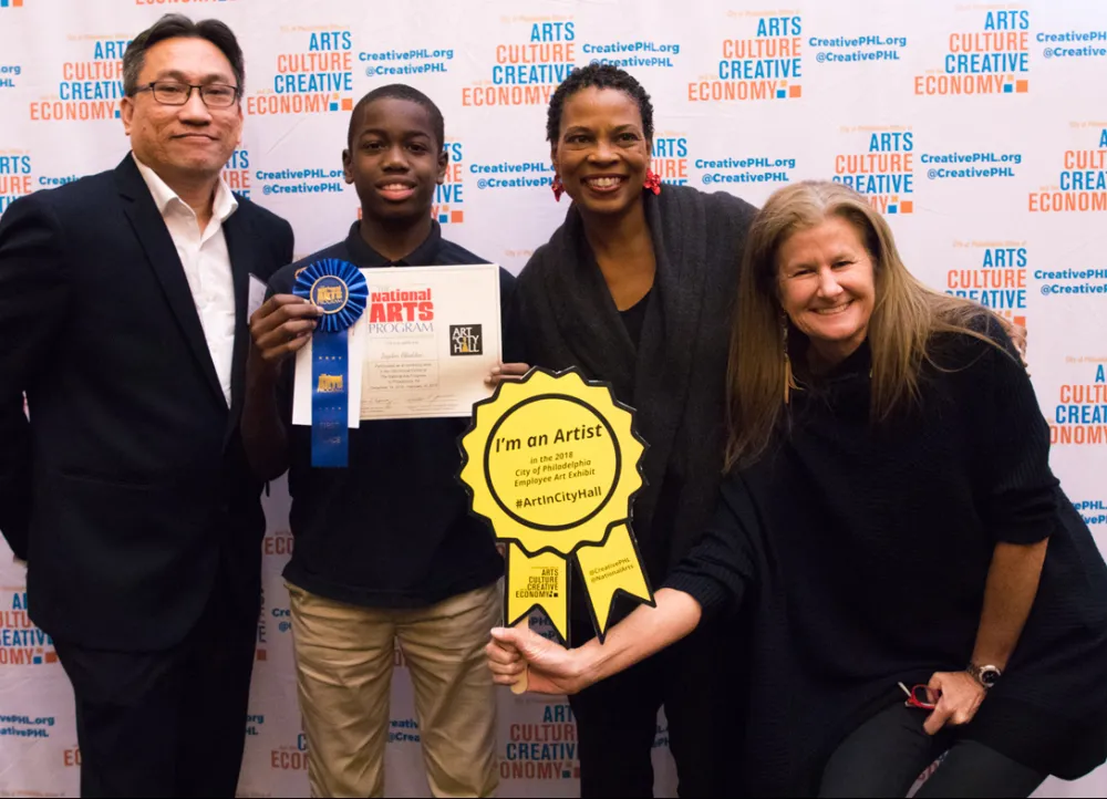 19th Annual Exhibit Jayden Gladden, First Place Winning Youth Artist with Tu Huynh, City Hall Exhibitions Manager; Kelly Lee, Chief Cultural Officer; & Jackie Szafara, NAP Executive Director