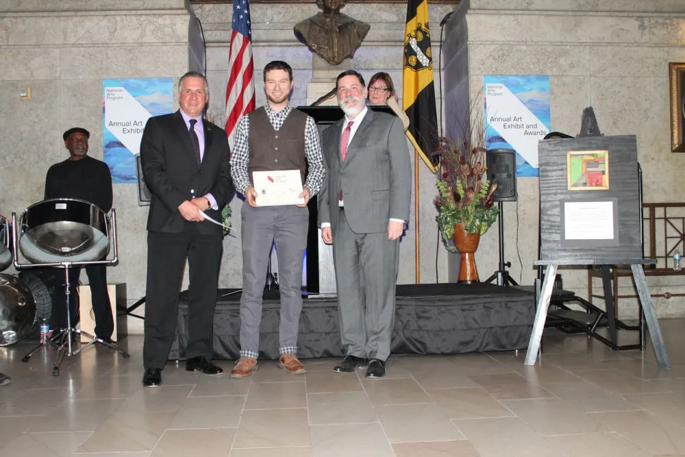 20th Annual Exhibit Benjamin Nicklow receives his First Place Award in the Amateur division.