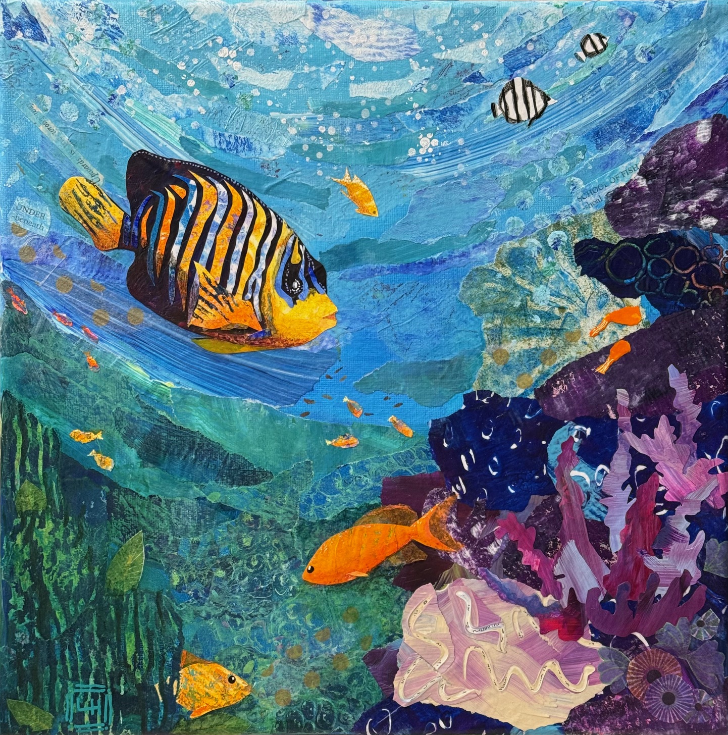 Mixed media torn-paper collage of multiple tropical fish swimming among coral