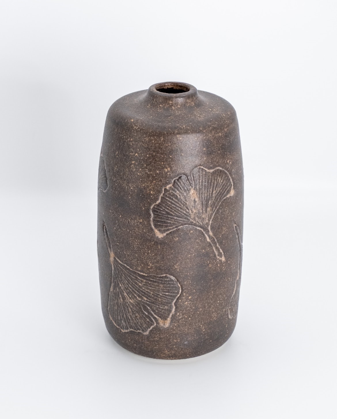 Carved stoneware vessel