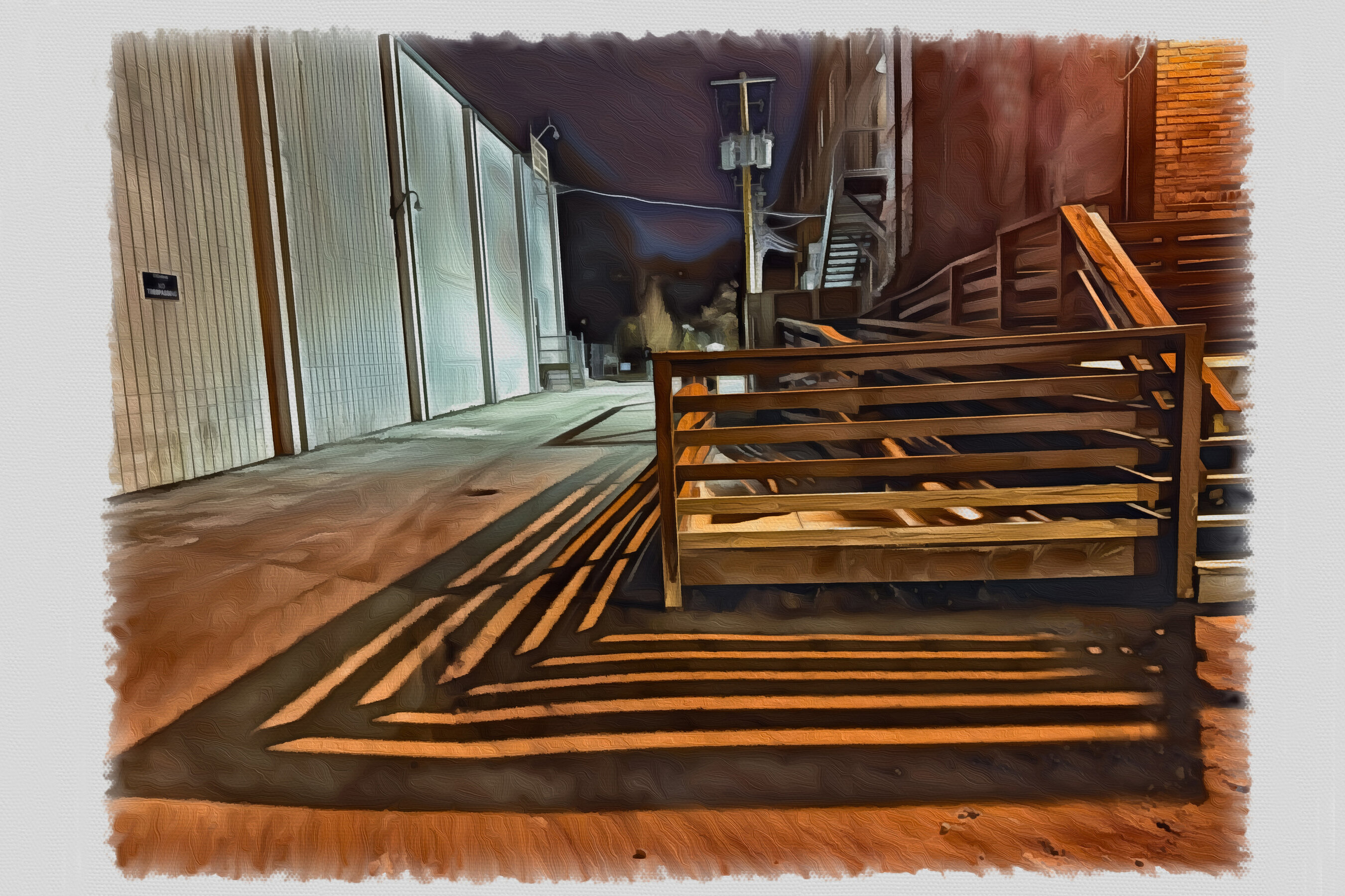 Shadows cast at night from the dock of an old warehouse.