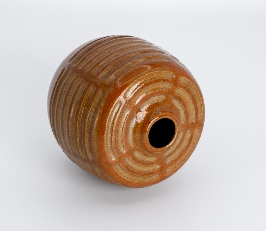 Carved stoneware vessel