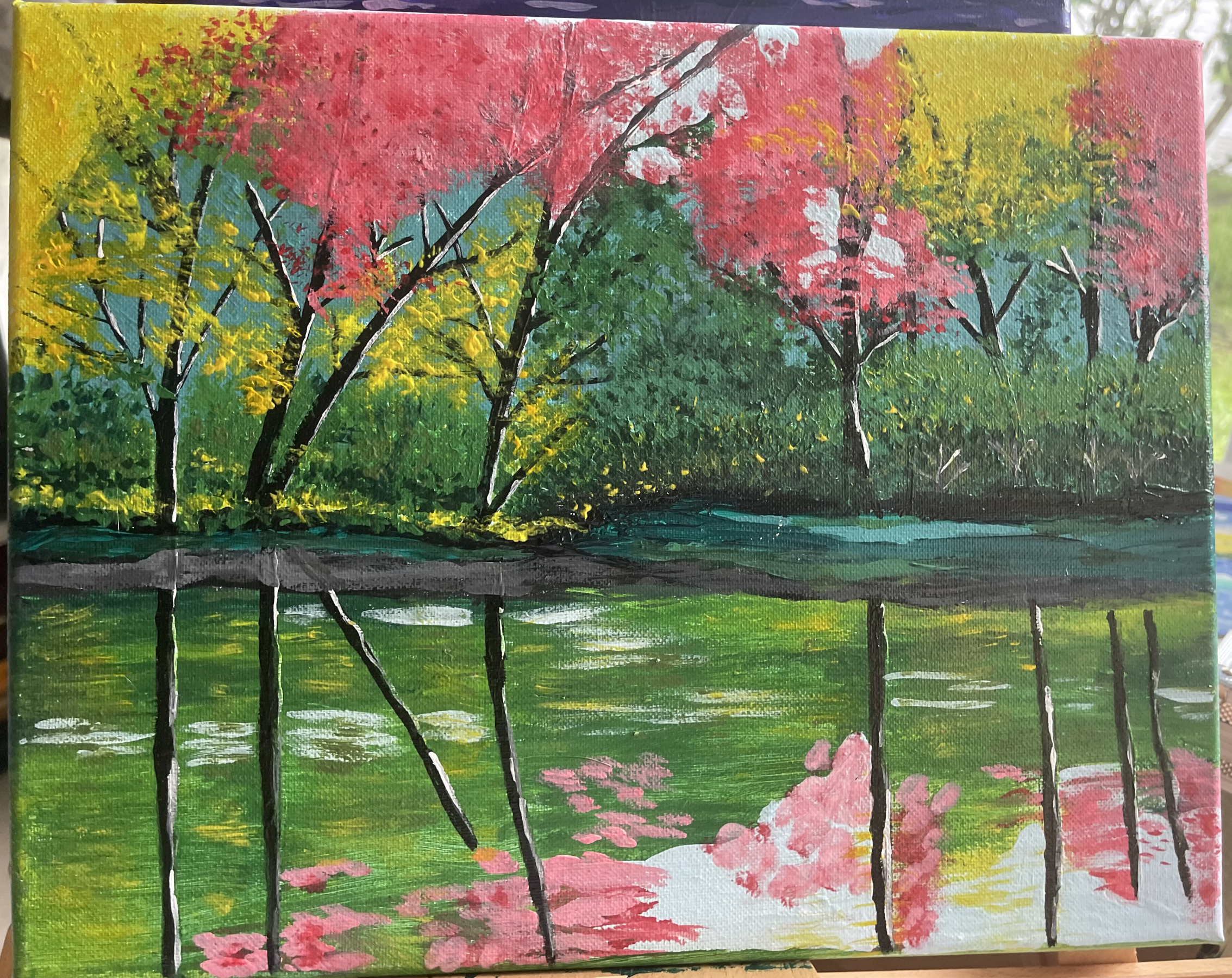 Painting of trees in fall by the river