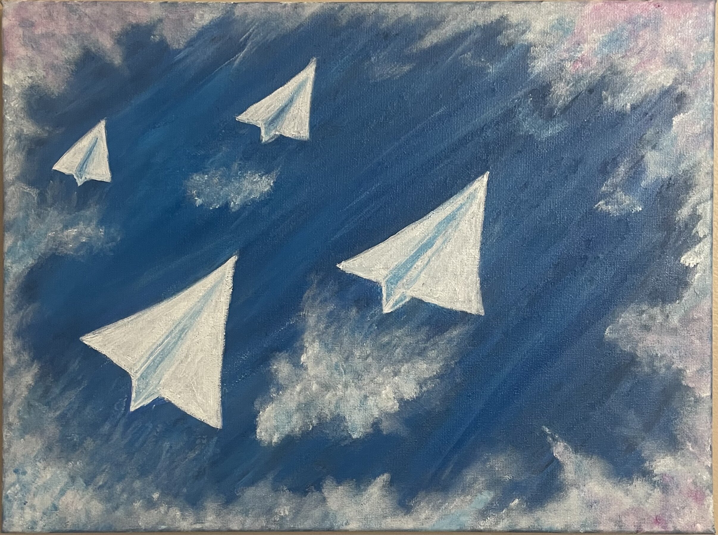 paper planes flying through the sky 