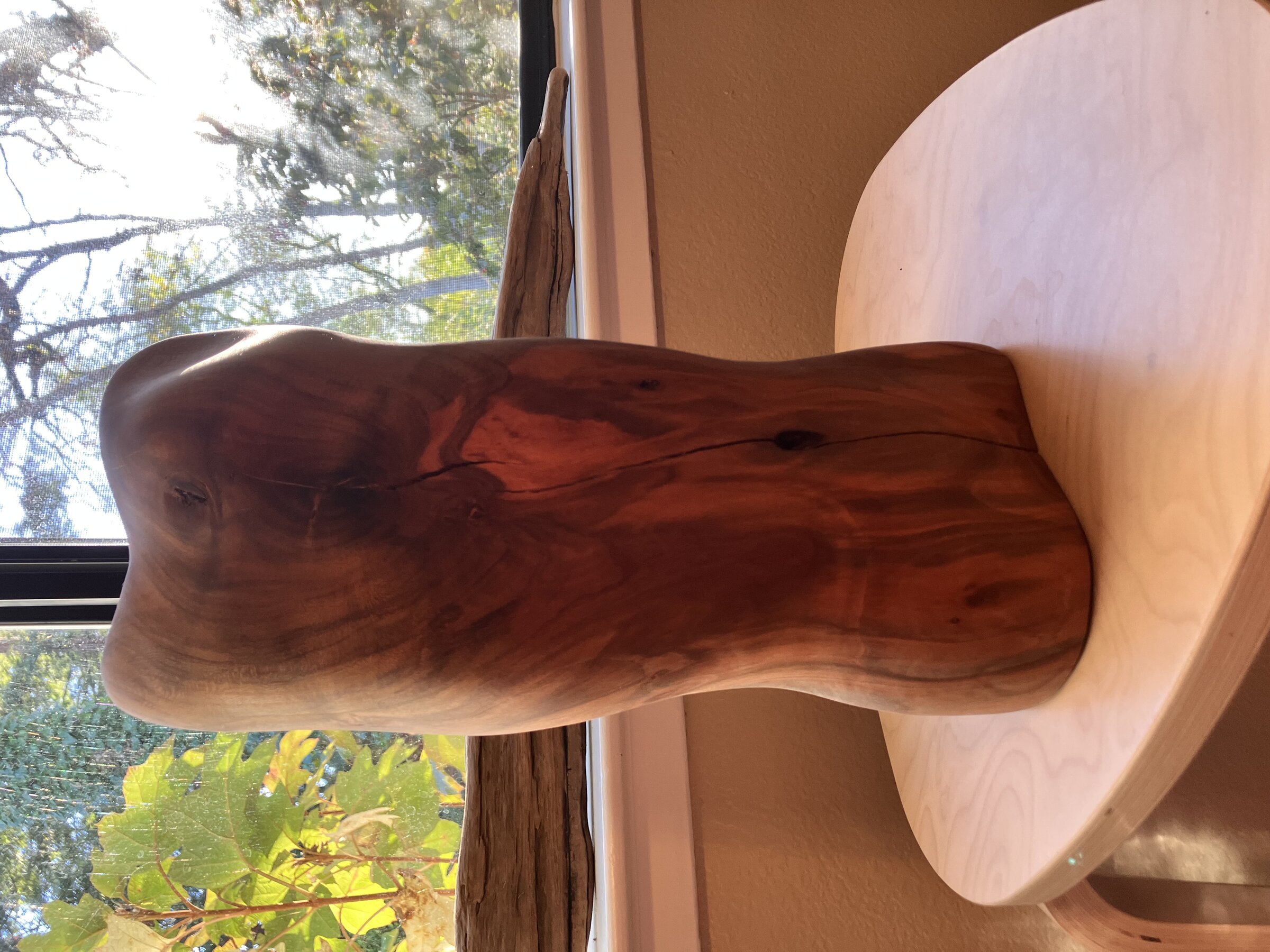 Abstract figure in almond wood