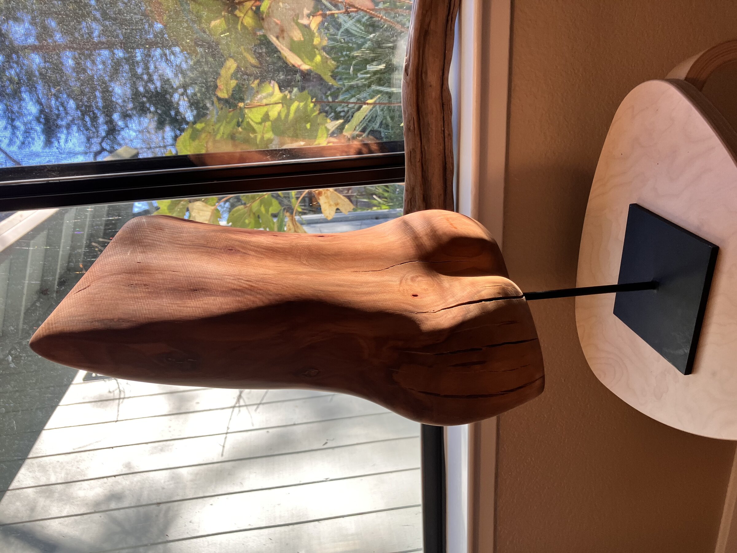 Abstract figure in almond wood