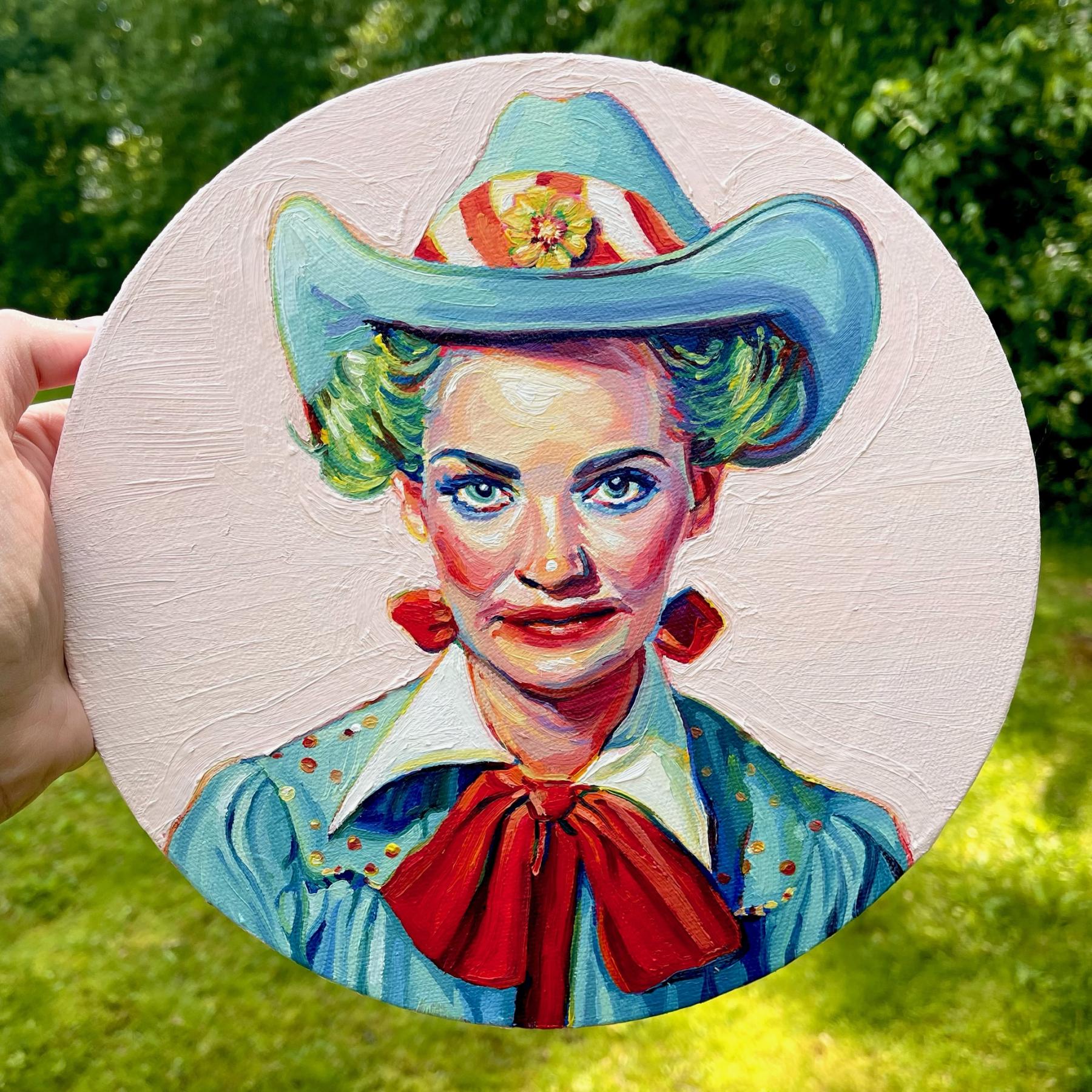 A mid century looking female rodeo clown on a round canvas. Her makeup is smudged. She's not terrifying, but a little off putting. Her hair is green and she has a teal cowboy hat with a yellow flower on the brim. 