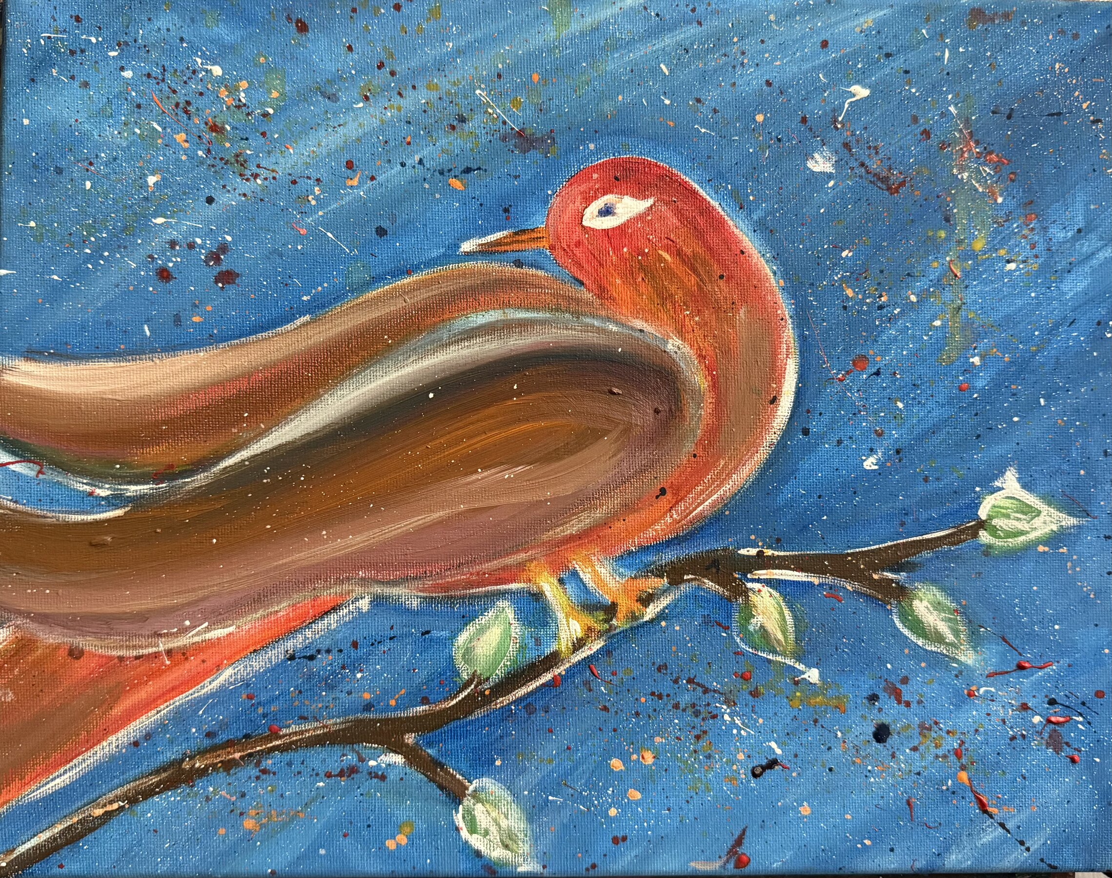  red bird on a branch with fire works in the sky 