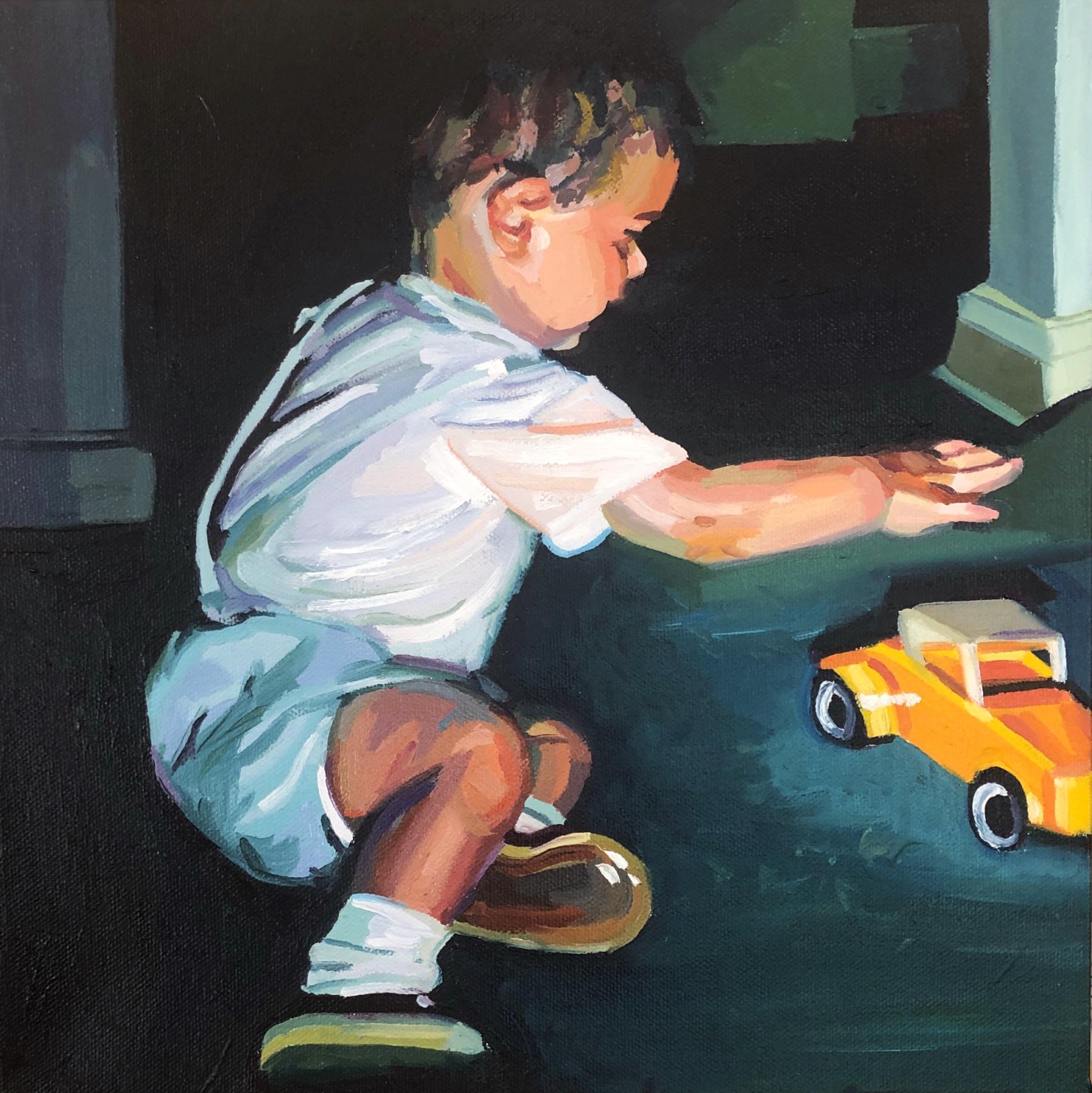 A mid century dressed two year old boy reaching for a yellow toy car. There is strong lighting with a black and dark green room background. 