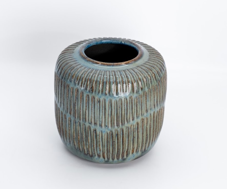 Carved stoneware vessel