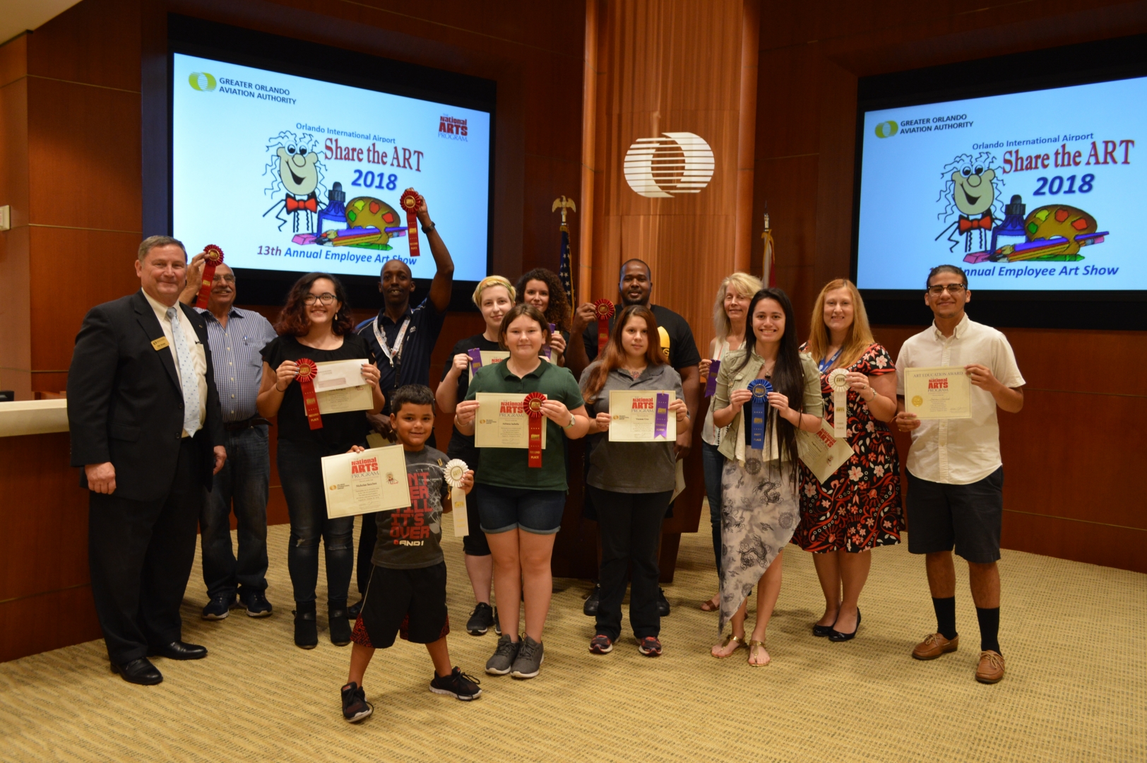 13th Annual Exhibit Proud winners posing with the CEO at the awards reception.