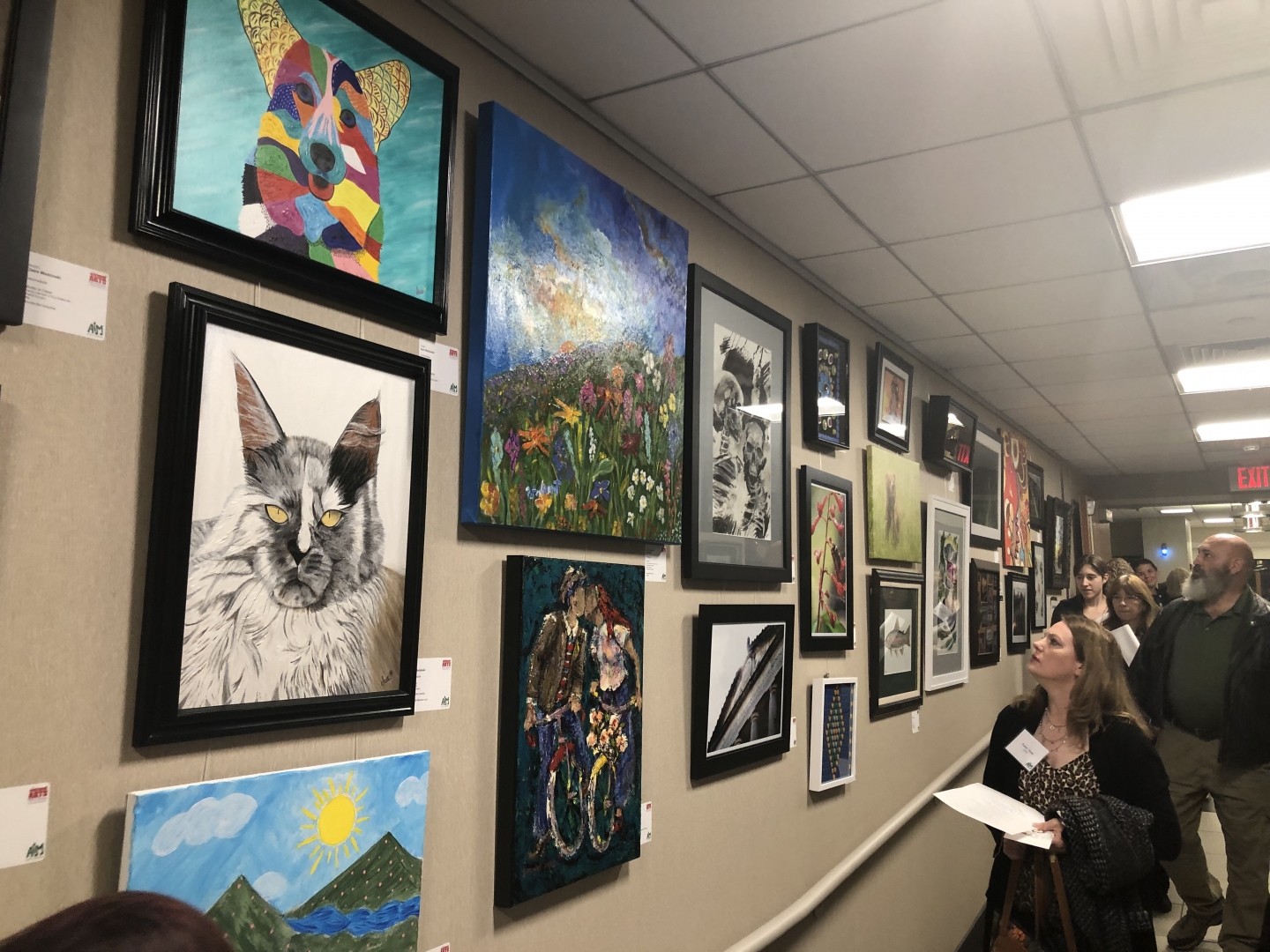 1st Annual Exhibit Attendees taking in the art at the first ever Huntsville Hospital Health System show.