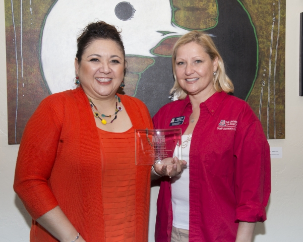 5th Annual Exhibit  On behalf of the NAP, the Executive Vice-President of Staff Advisory Council Charlotte Honeycutt  presented Coordinator Claudia Arias with our 5th Anniversary Award.