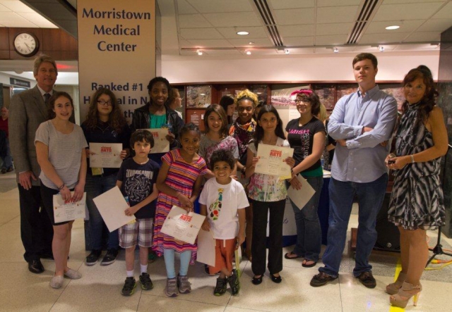7th Annual Exhibit Youth & teen winners pose with Joseph A. Trunfio, President & CEO and Maria Lupo, Venue Coordiantor during the awards reception.
