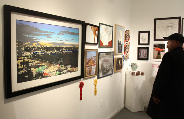 16th Annual Exhibit Admiring all the art on the walls of the Arts Collinswood Gallery