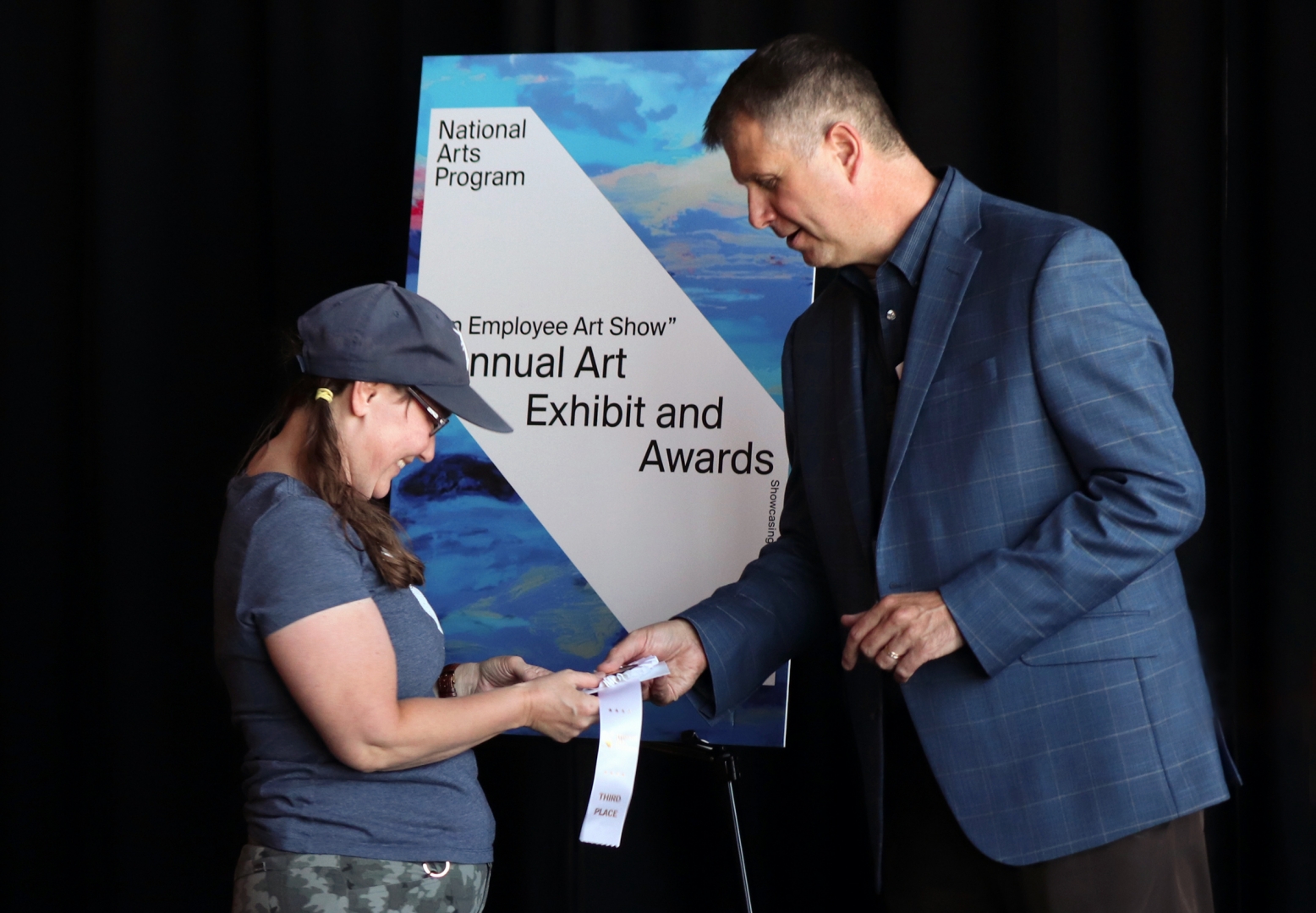 13th Annual Exhibit Karen Inda Accepting Award from RTAA CEO Daren Griffin