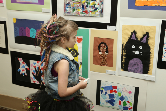 20th Annual Exhibit Taking in the youth artwork at the Cleveland show